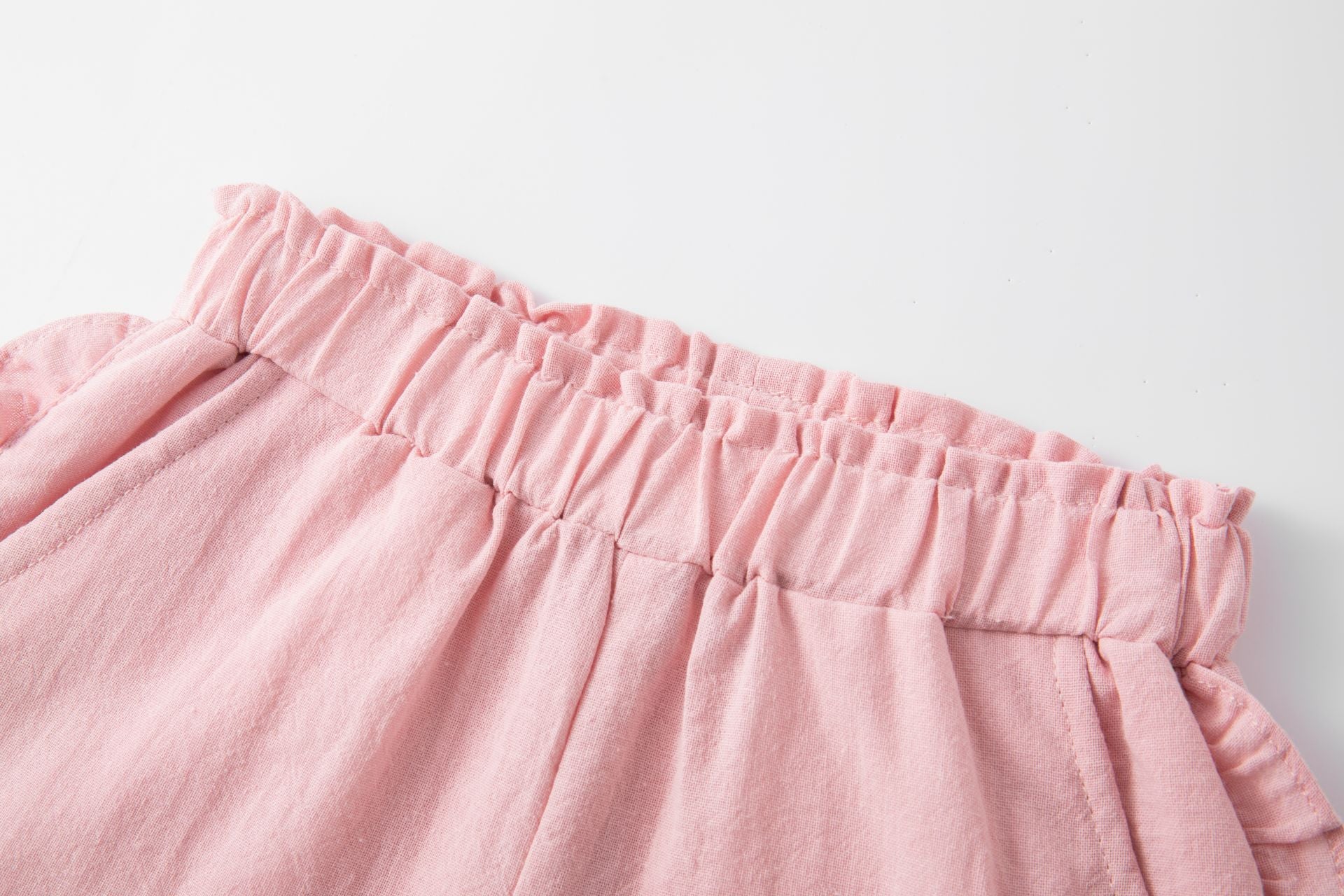 Pink cotton shorts with ruffles