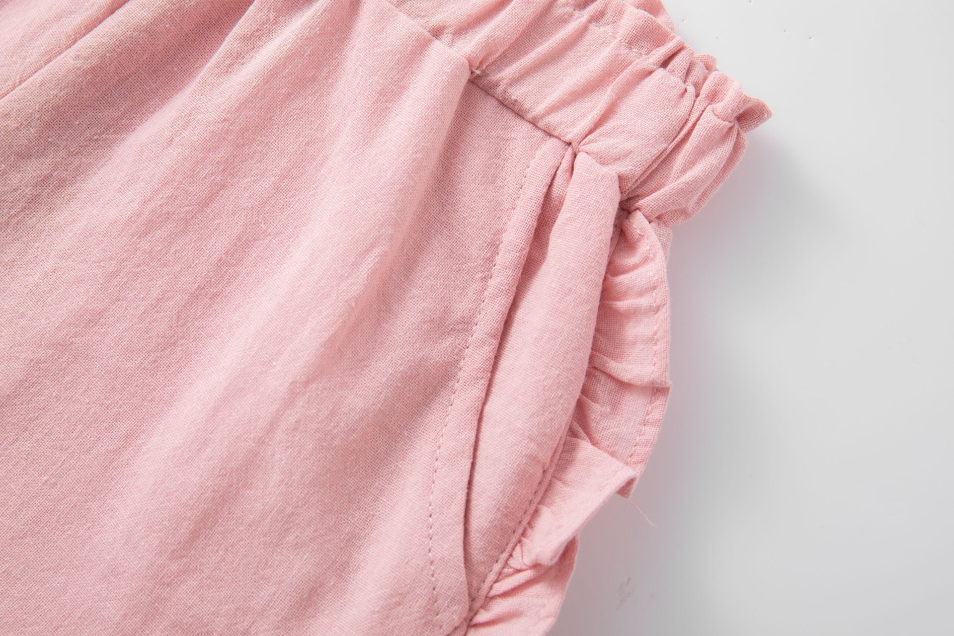 Pink cotton shorts with ruffles