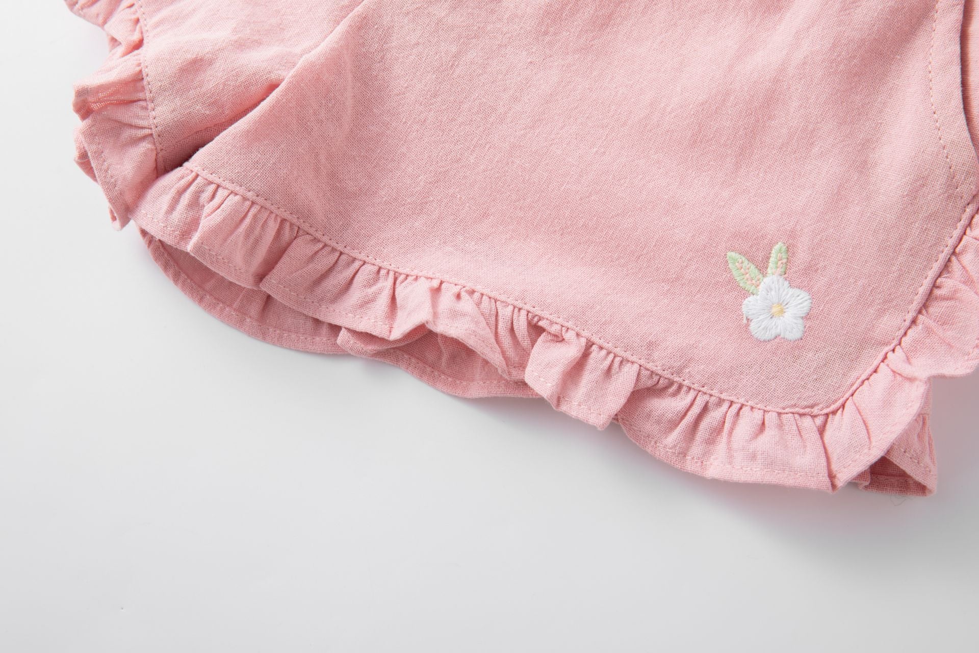 Pink cotton shorts with ruffles