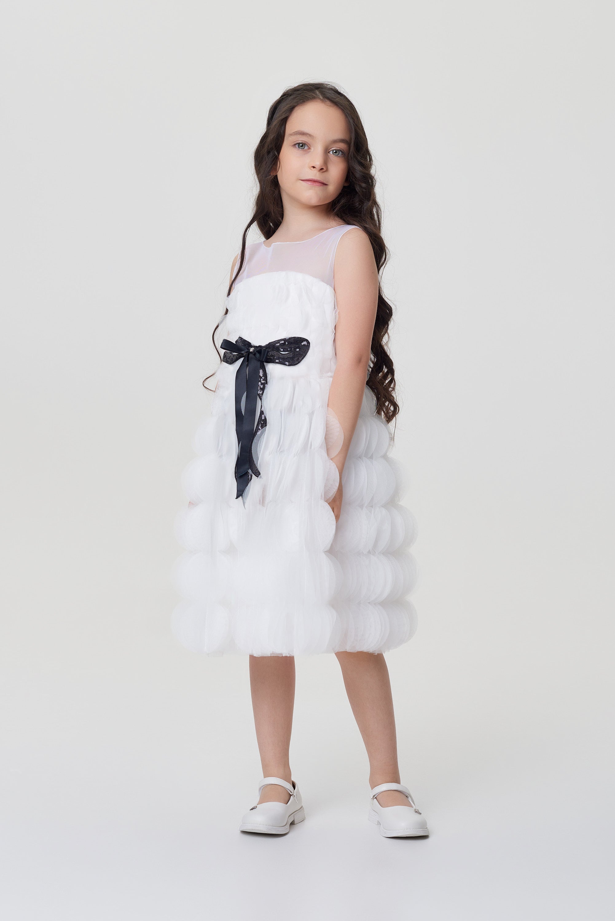 White dress with a black bow belt