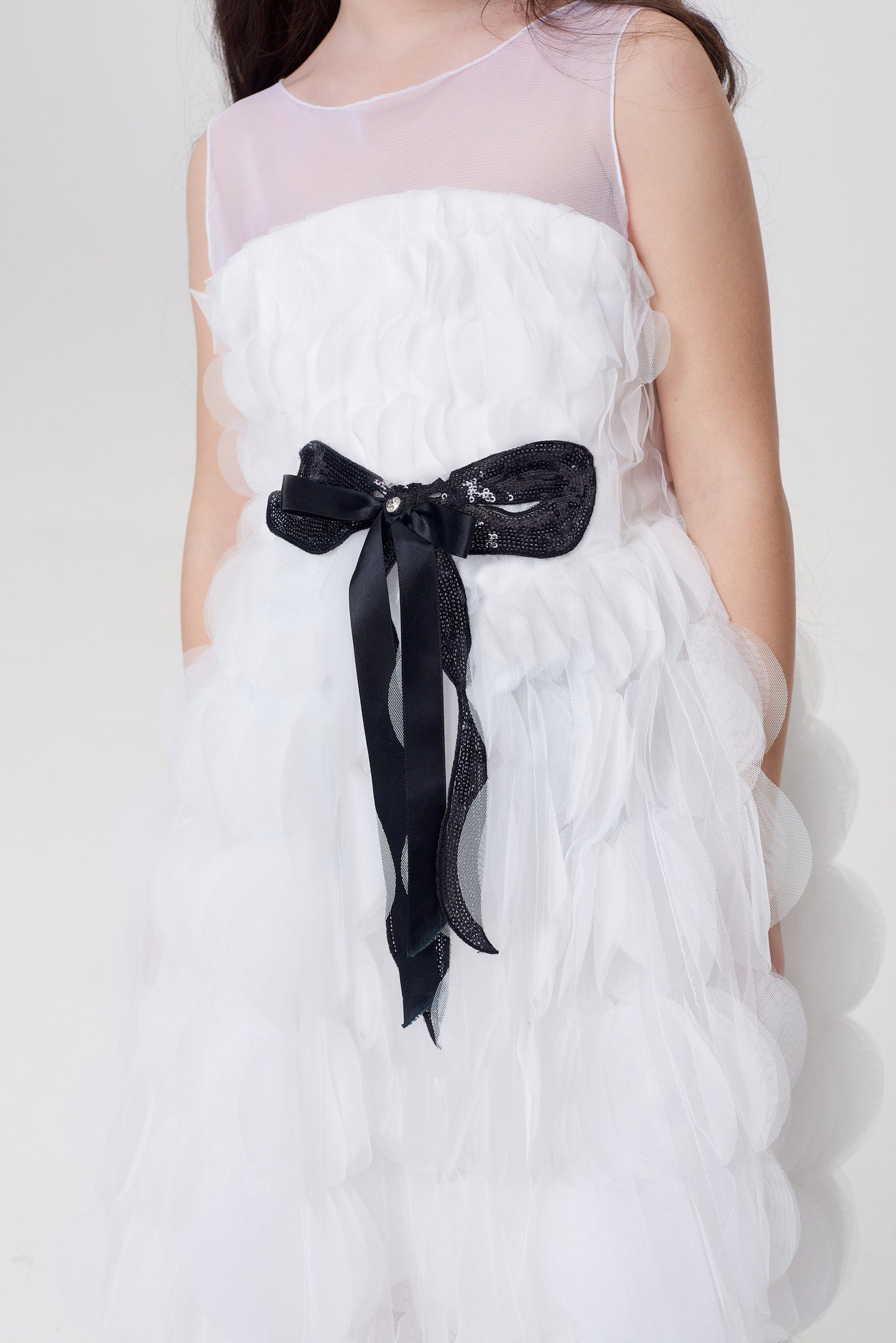 White dress with a black bow belt