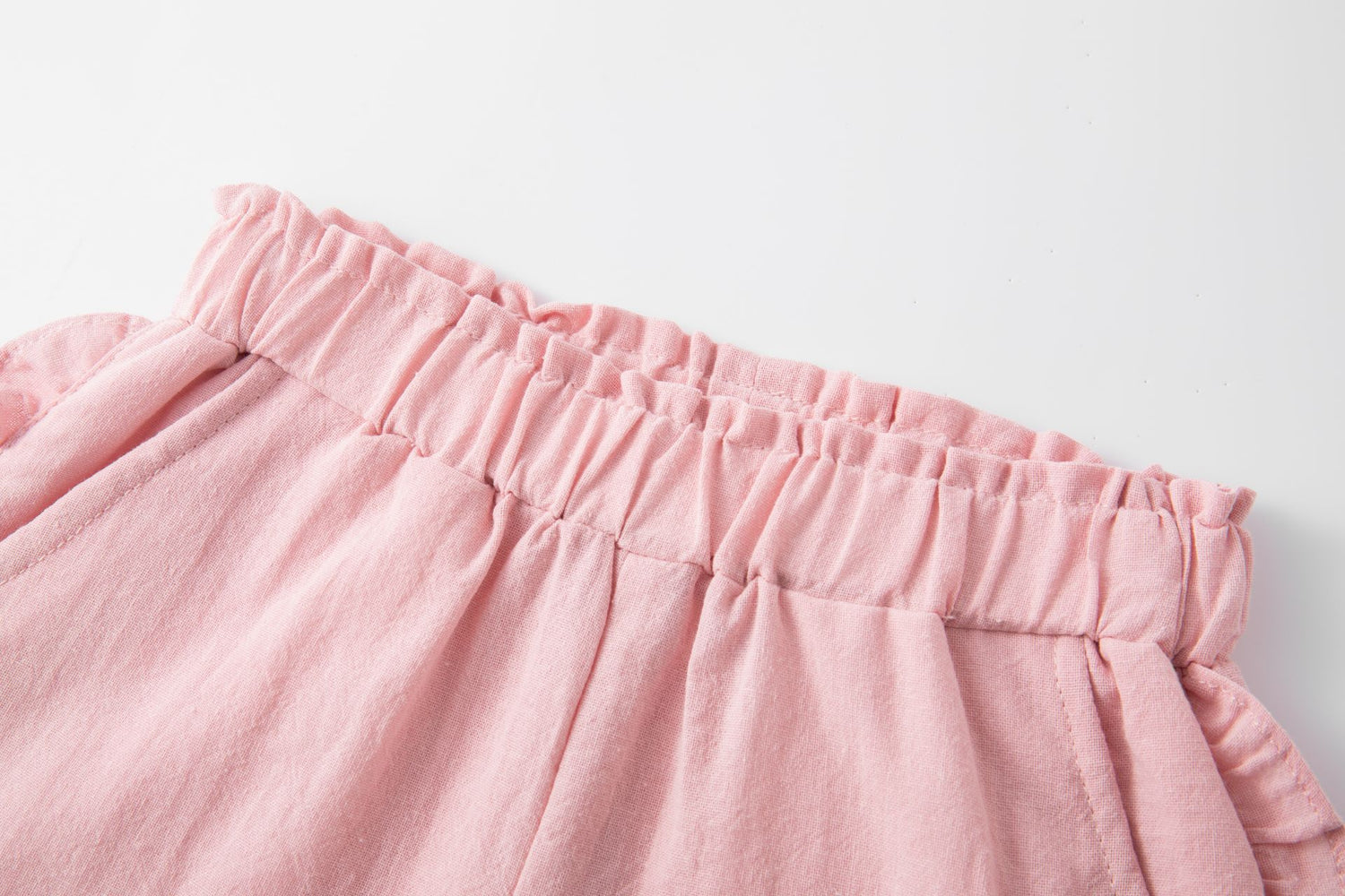 Pink cotton shorts with ruffles
