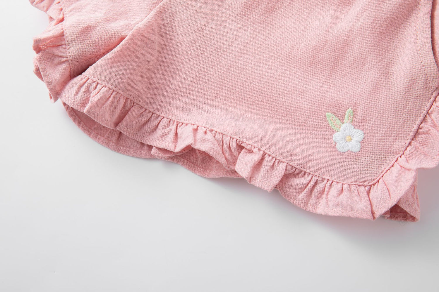 Pink cotton shorts with ruffles
